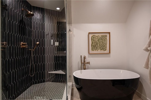 bathroom featuring separate shower and tub and tile patterned floors