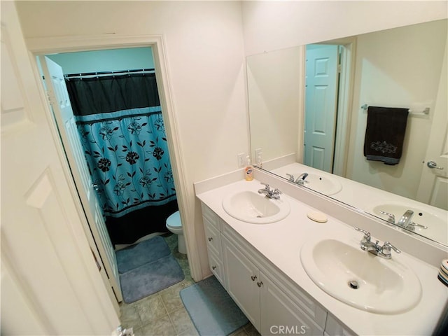 bathroom featuring tile patterned floors, vanity, toilet, and a shower with shower curtain