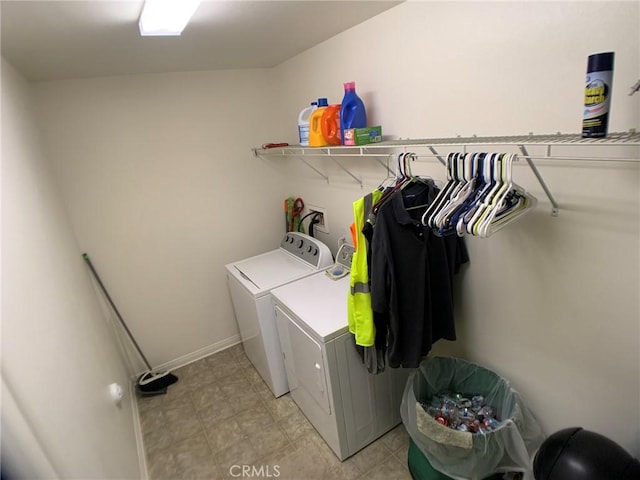 laundry room with washing machine and clothes dryer