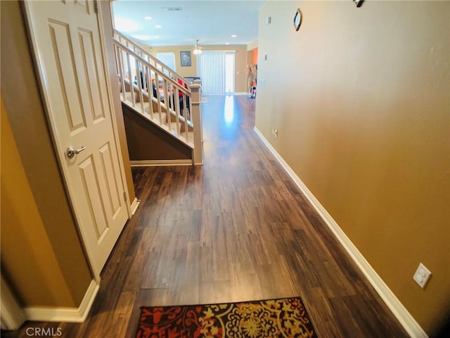 hall with dark hardwood / wood-style floors