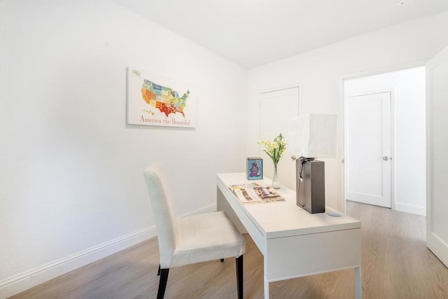 office space with light hardwood / wood-style floors