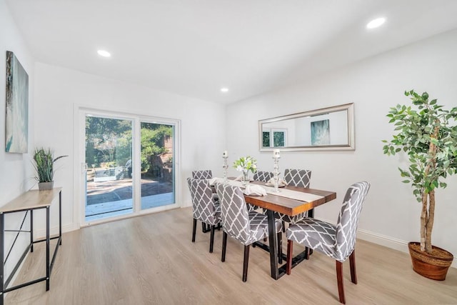 dining area with light hardwood / wood-style flooring