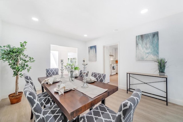 dining area featuring light wood-type flooring