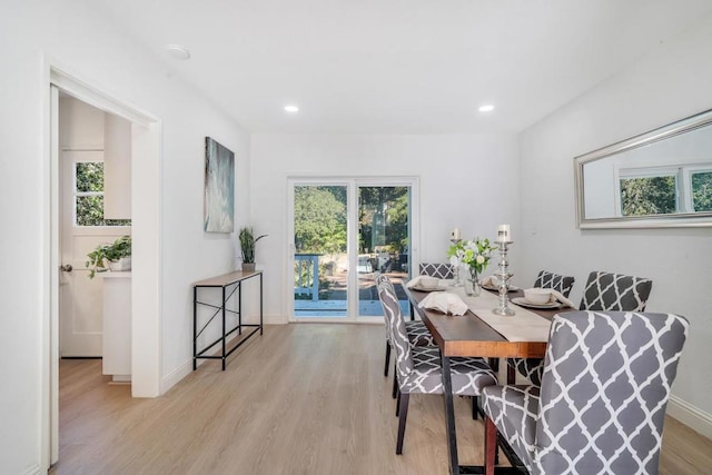 dining area featuring light hardwood / wood-style flooring and plenty of natural light