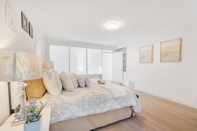 bedroom featuring light wood-type flooring