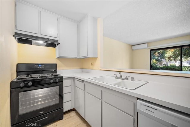 kitchen with white cabinets, sink, dishwasher, and black gas stove