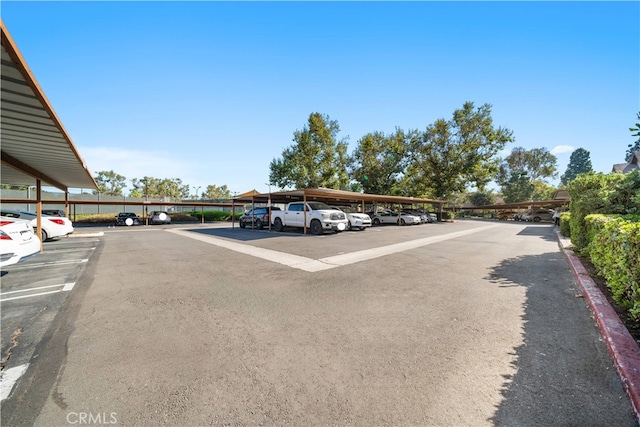 view of vehicle parking with a carport