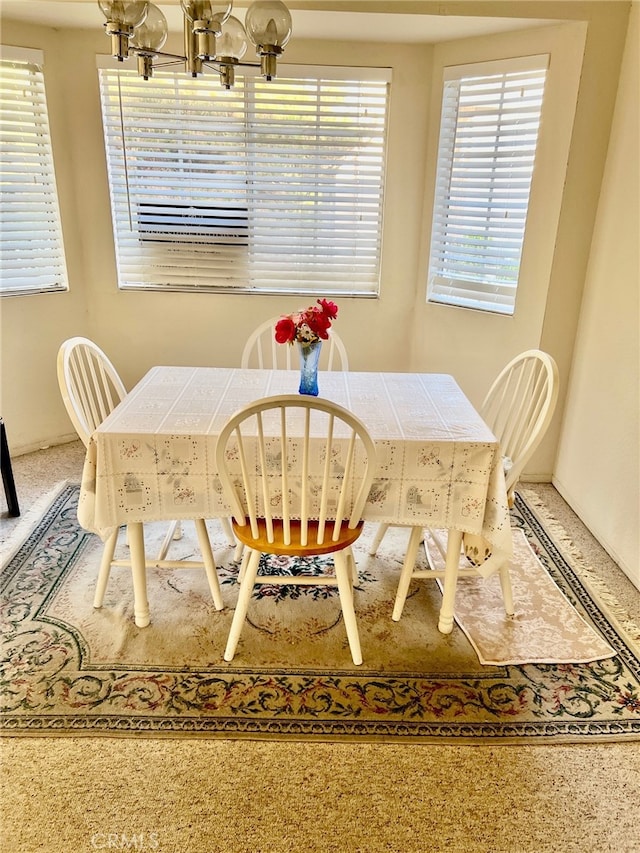 dining space featuring a chandelier