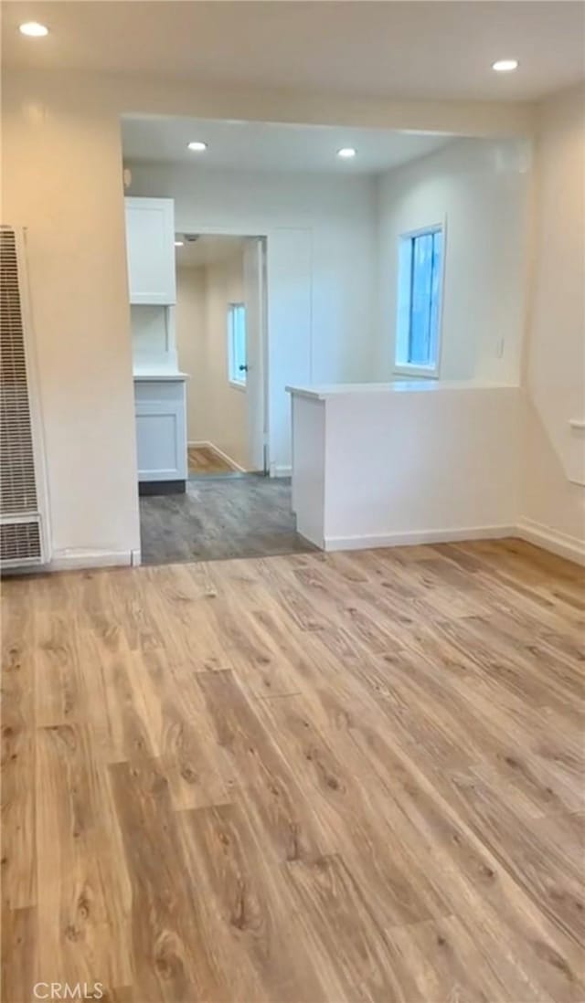 empty room with light hardwood / wood-style floors