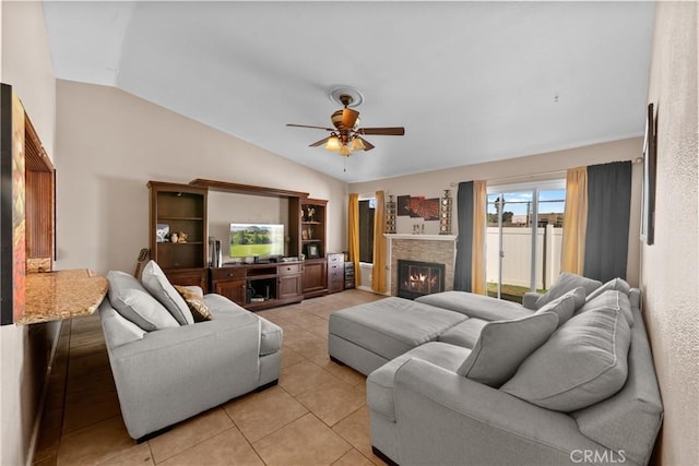 tiled living room with lofted ceiling and ceiling fan