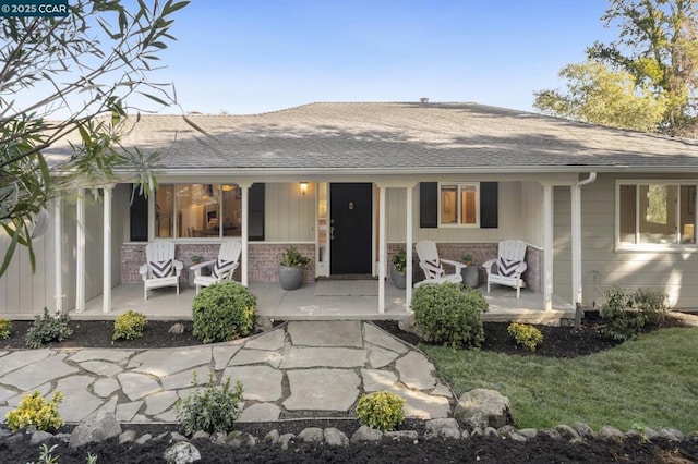 back of house with a porch