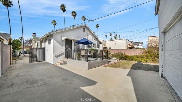 rear view of property featuring a patio area