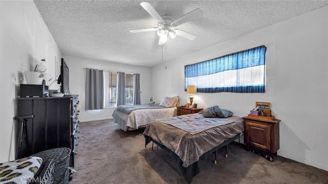 bedroom featuring dark carpet, a textured ceiling, and ceiling fan