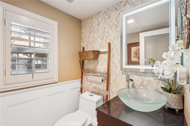 bathroom with vanity and toilet