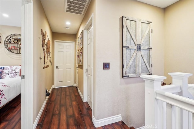 corridor featuring dark hardwood / wood-style flooring