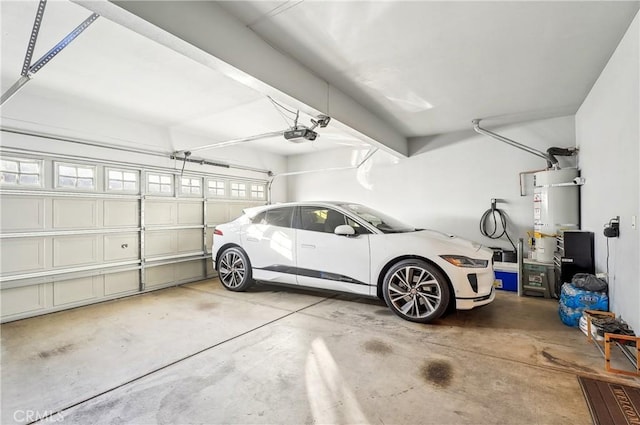 garage featuring a garage door opener and water heater