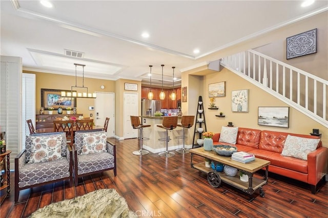 living room featuring crown molding and dark hardwood / wood-style flooring