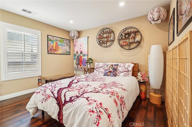 bedroom featuring dark hardwood / wood-style floors