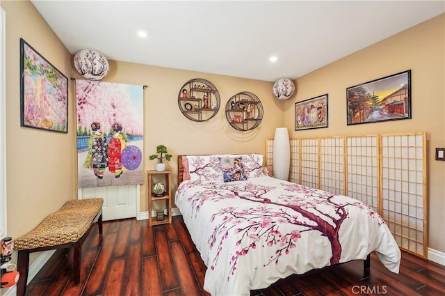 bedroom with dark wood-type flooring