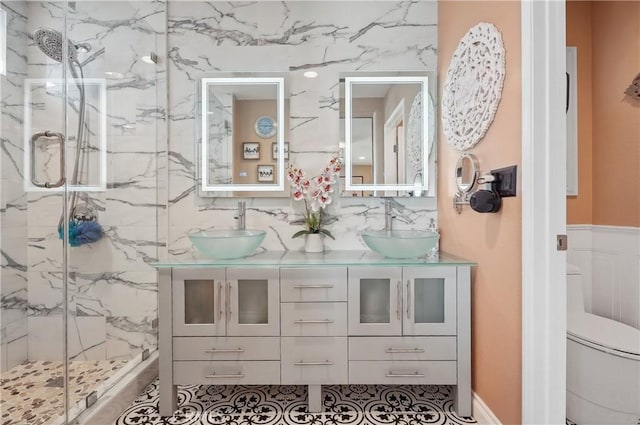 bathroom featuring vanity, an enclosed shower, backsplash, and toilet