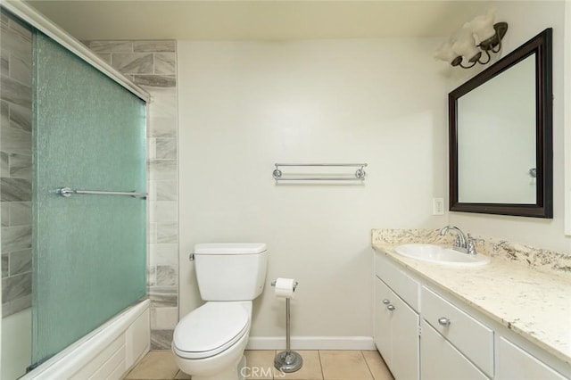 full bathroom with vanity, shower / bath combination with glass door, tile patterned floors, and toilet