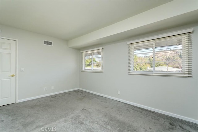 unfurnished room with light carpet