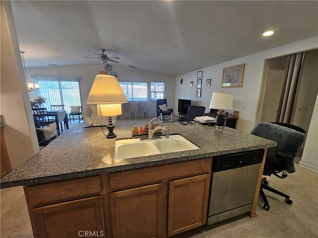 kitchen featuring lofted ceiling, ceiling fan, dishwasher, sink, and a kitchen breakfast bar