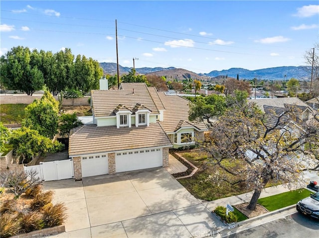 birds eye view of property with a mountain view