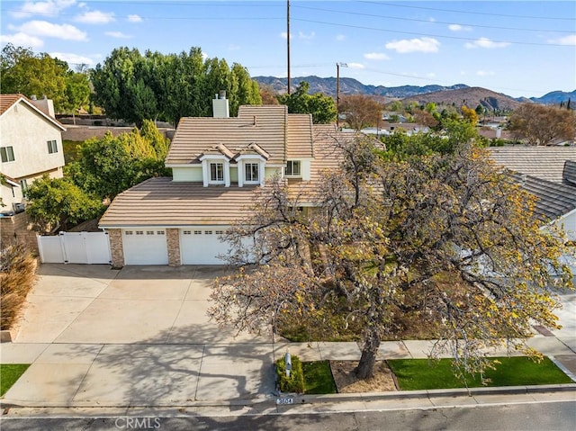 view of front of property featuring a mountain view and a garage