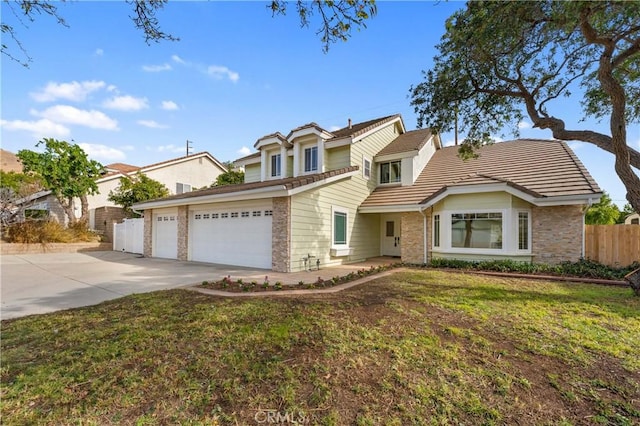 view of front property with a front yard and a garage