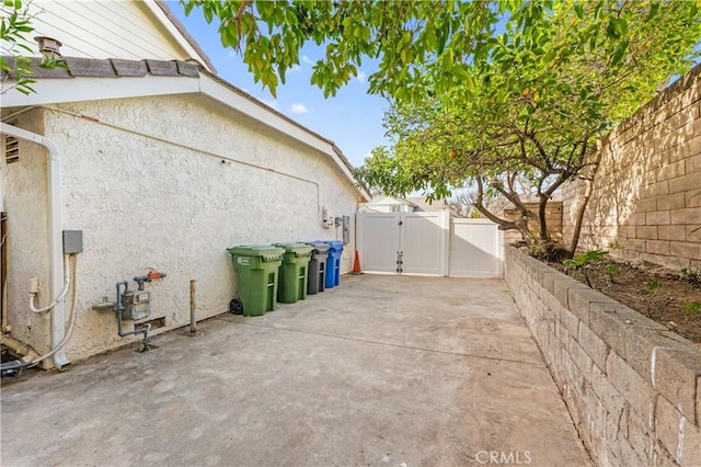 view of side of property with a patio area