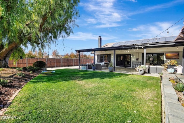 view of yard featuring central AC unit, an outdoor living space, and a patio