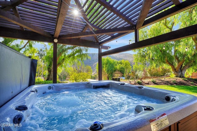 view of pool featuring a pergola, a mountain view, and a hot tub