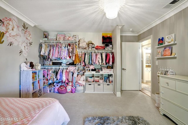 bedroom featuring light carpet, a closet, and ornamental molding