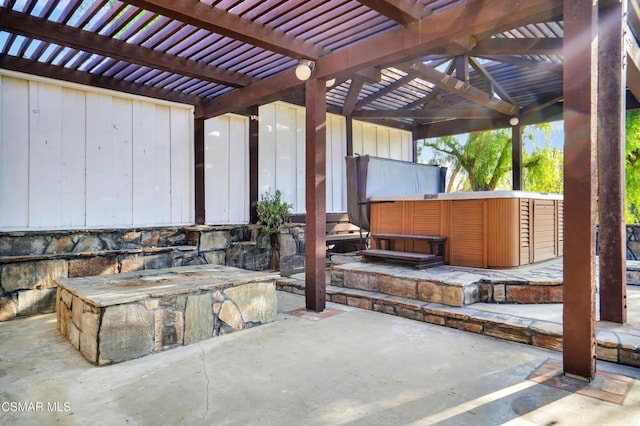 view of patio with a pergola and a hot tub