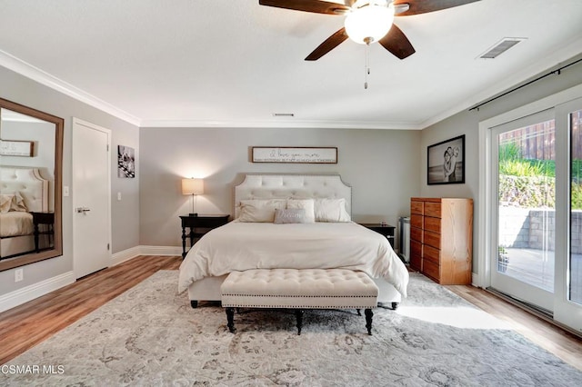 bedroom featuring ceiling fan, access to exterior, crown molding, and light hardwood / wood-style floors