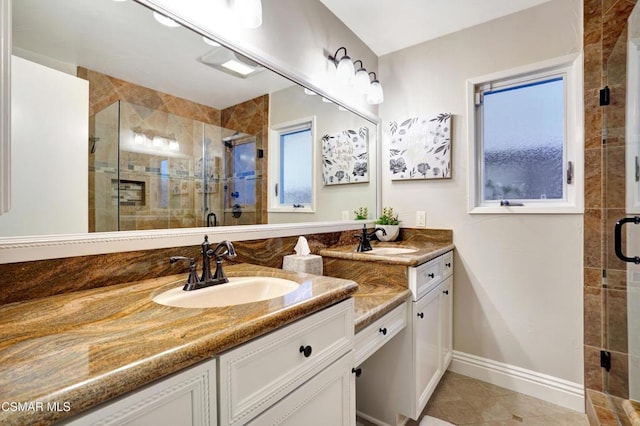 bathroom with vanity, tile patterned flooring, and walk in shower