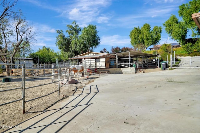 view of property's community with an outbuilding