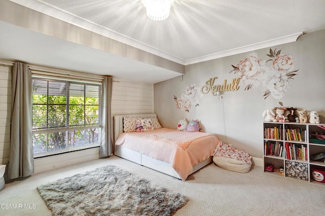 bedroom featuring crown molding and carpet floors