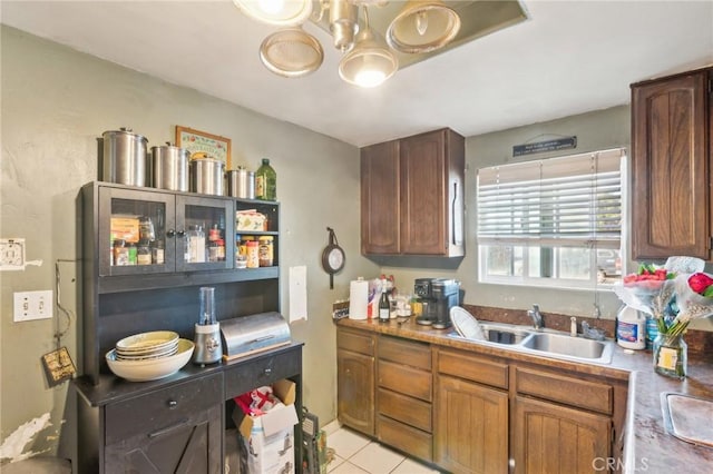 kitchen with sink and light tile patterned floors