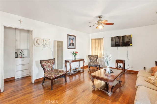 living room with ceiling fan and hardwood / wood-style floors