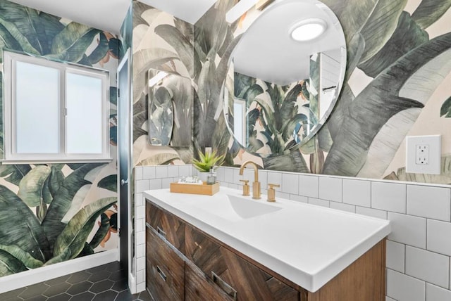 bathroom with vanity and tile walls