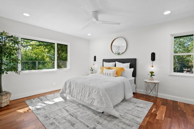 bedroom with ceiling fan and hardwood / wood-style floors