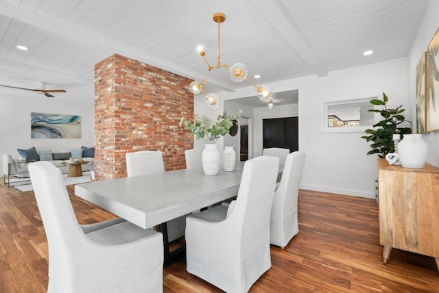 dining room featuring hardwood / wood-style floors, beam ceiling, and a notable chandelier