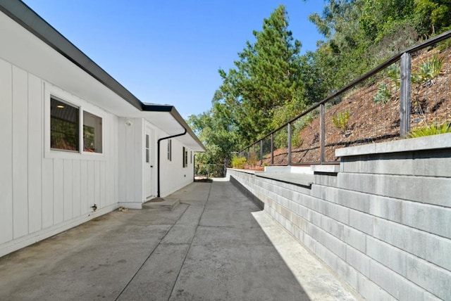 view of side of home featuring a patio area