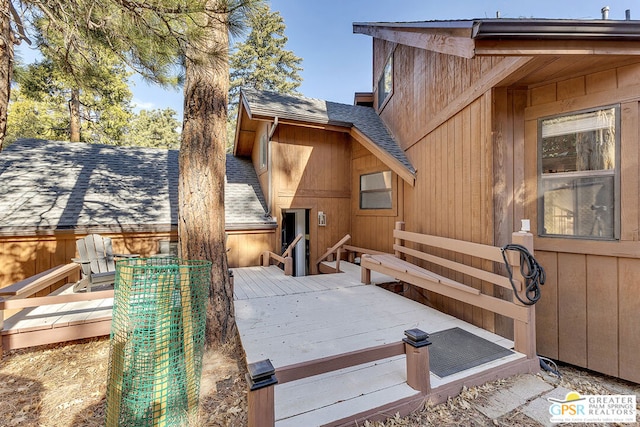 view of home's exterior with a wooden deck