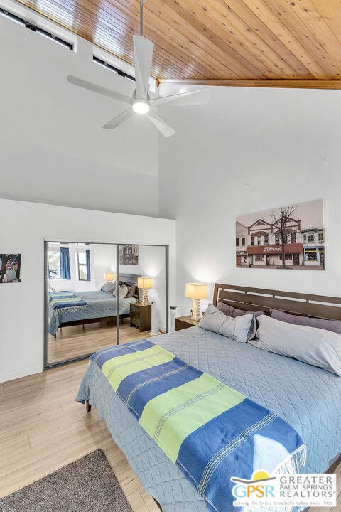 bedroom with lofted ceiling, ceiling fan, wood ceiling, and light hardwood / wood-style floors