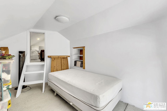 bedroom with carpet and vaulted ceiling