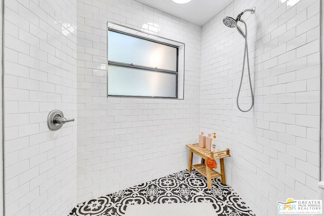 bathroom with tiled shower