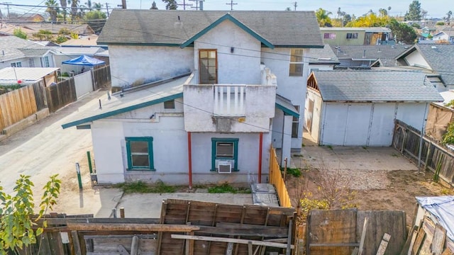 rear view of property with cooling unit